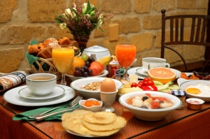 breakfast table laden with food